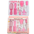 Portable baby health suit 9-piece grooming set in pink with scissors, clippers, comb and thermometer on white background