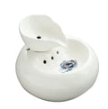 White ceramic automatic cat water dispenser with leaf design and US plug on a wooden floor