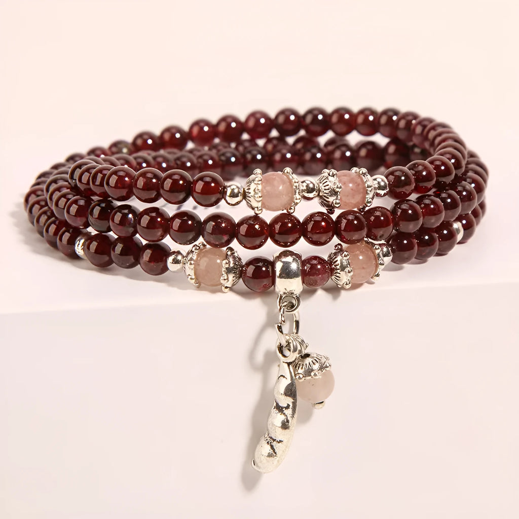 Women's crystal bracelet with wine red garnet colour and flower shape, featuring Bohemian and ethnic design elements.