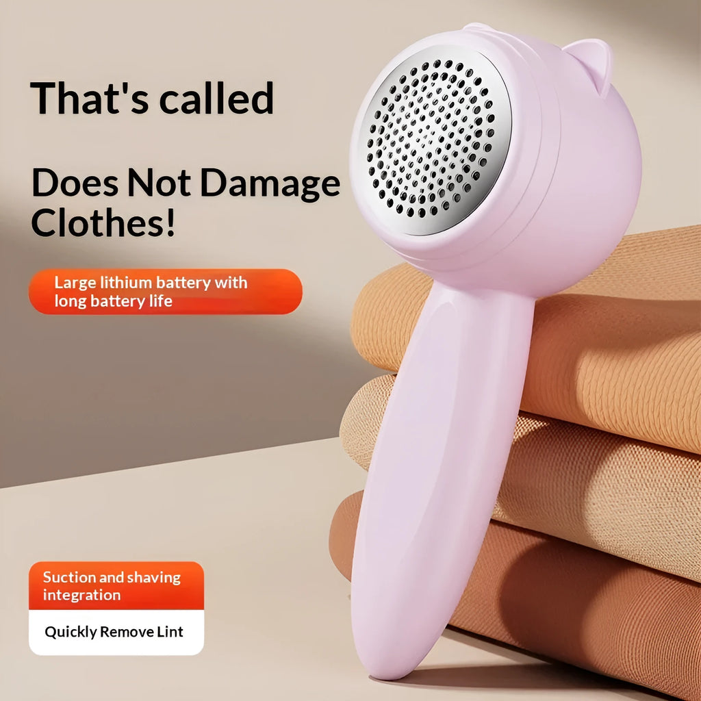 Small cat portable rechargeable lint remover in cream colour on fabric surface