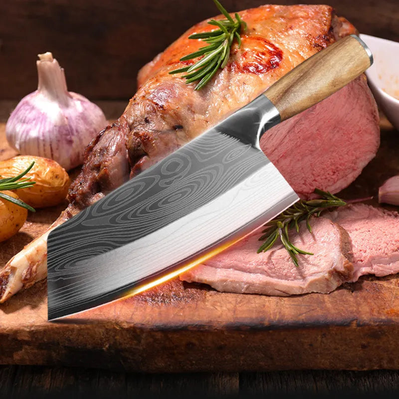 Forged stainless steel kitchen knife with a 320mm blade on a wooden cutting board.