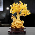 Citrine-coloured resin ornament of a turtle money tree in Chinese Feng Shui style.