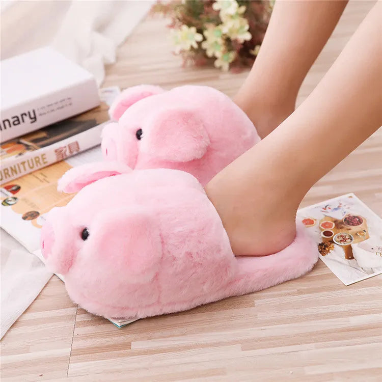 Pink adult pig slippers with short plush lining and a size chart showing international conversions.