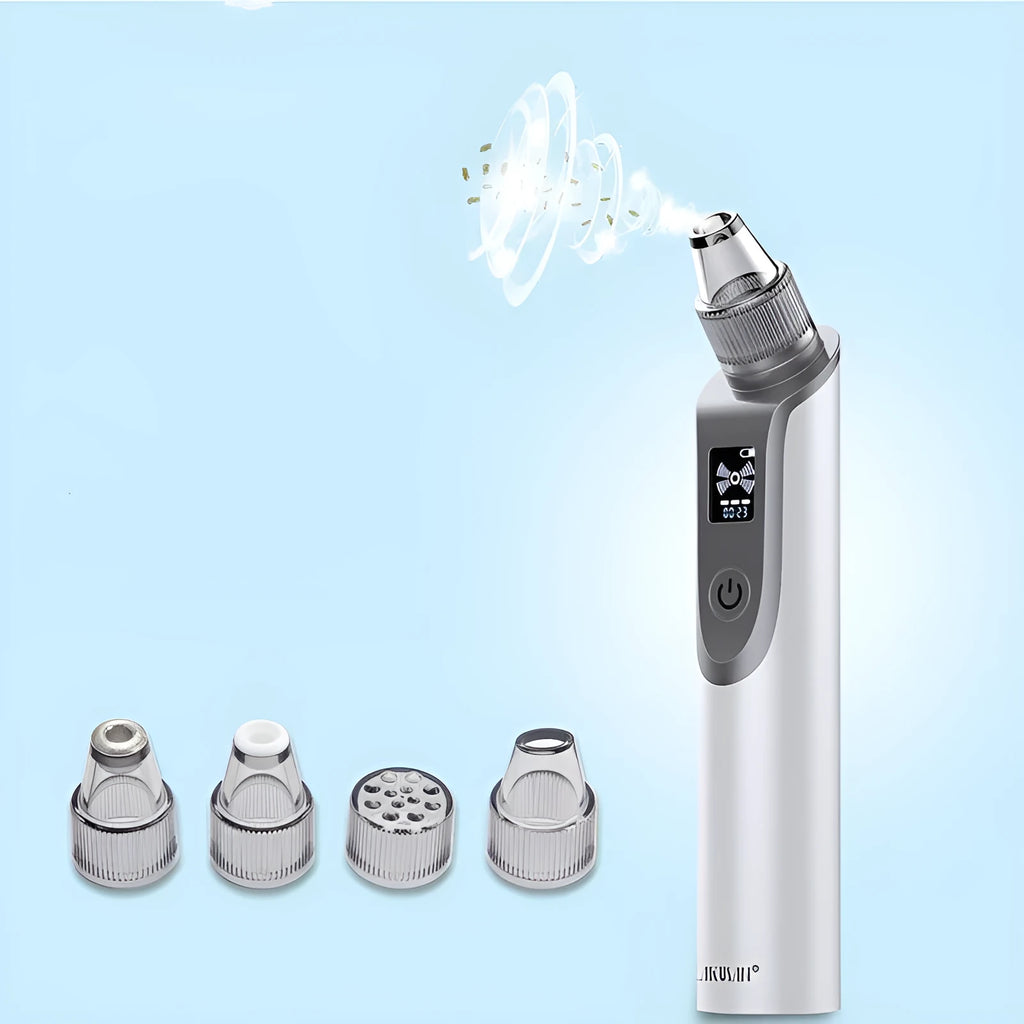 White handheld ultrasonic facial cleansing instrument with interchangeable suction heads on a clean surface.