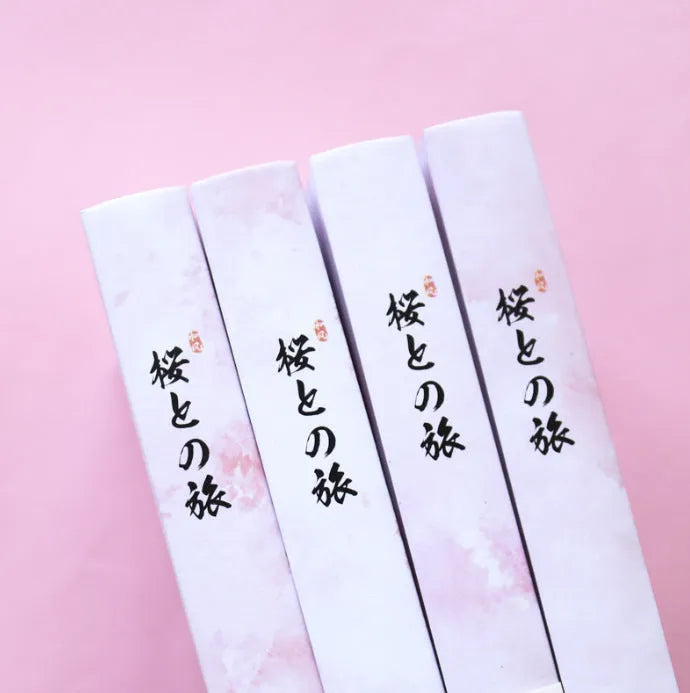Muco hardcover notebook with sakura flower orbit AR design in pink, green, red, and yellow colour options.
