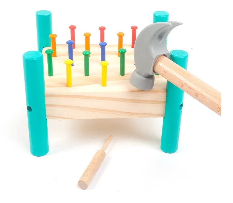 Wooden knock table with 17 colourful nails, hammer and reverse knock on khaki wood base