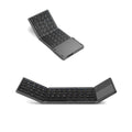 Black tri-fold Bluetooth keyboard showing folded thickness next to tablet for size comparison