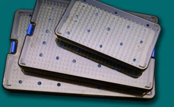 A flexible, translucent silicone disinfection box with a lid, shown in three different sizes for sanitising personal items.