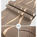 Close-up of dark brown 3D striped wallpaper with thick deerskin velvet texture.