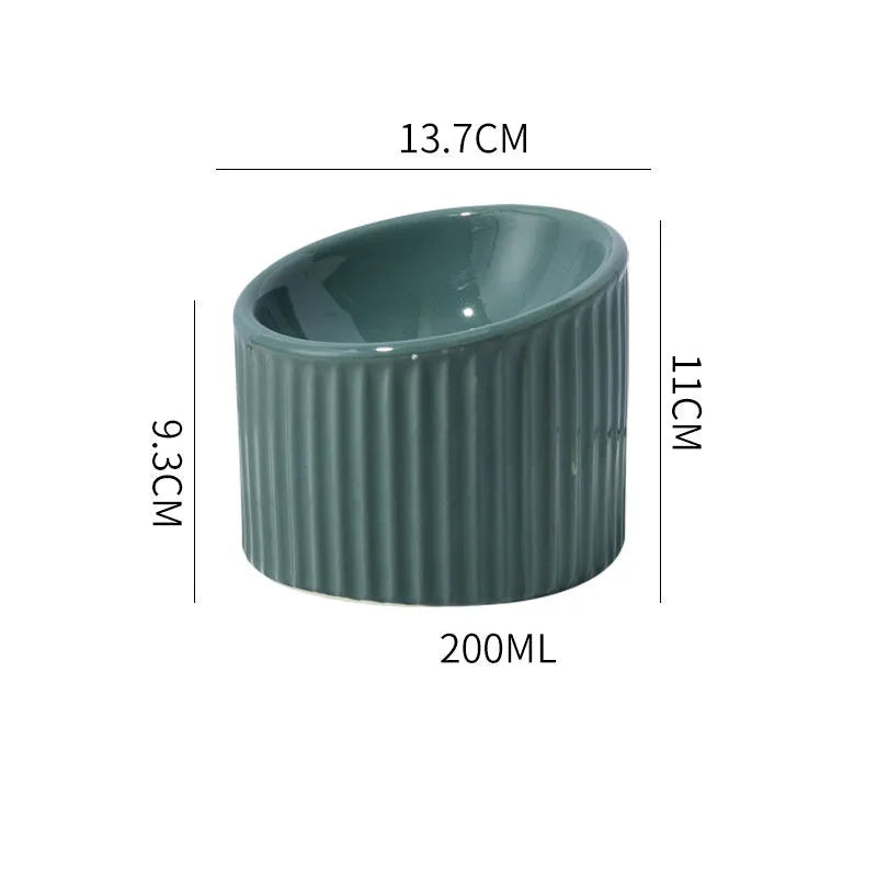 Elevated ceramic cat bowl in light green colour with tilted round design for comfortable feeding