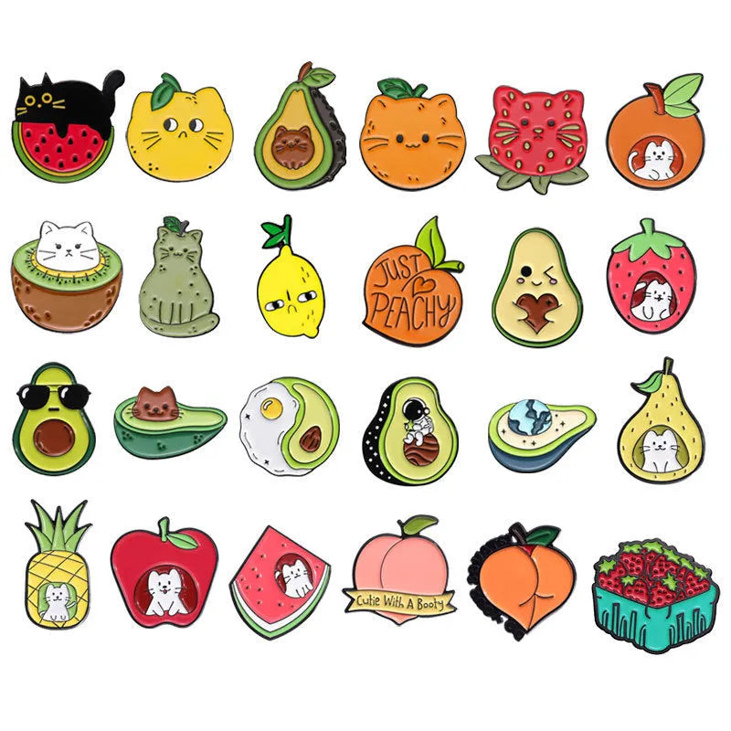 Colourful cartoon fruit design metal brooch with pin clasp on a denim jacket.