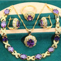 Gold plated jewellery set with coloured cubic zirconia stones, showing necklace, earrings, ring, and bracelet.