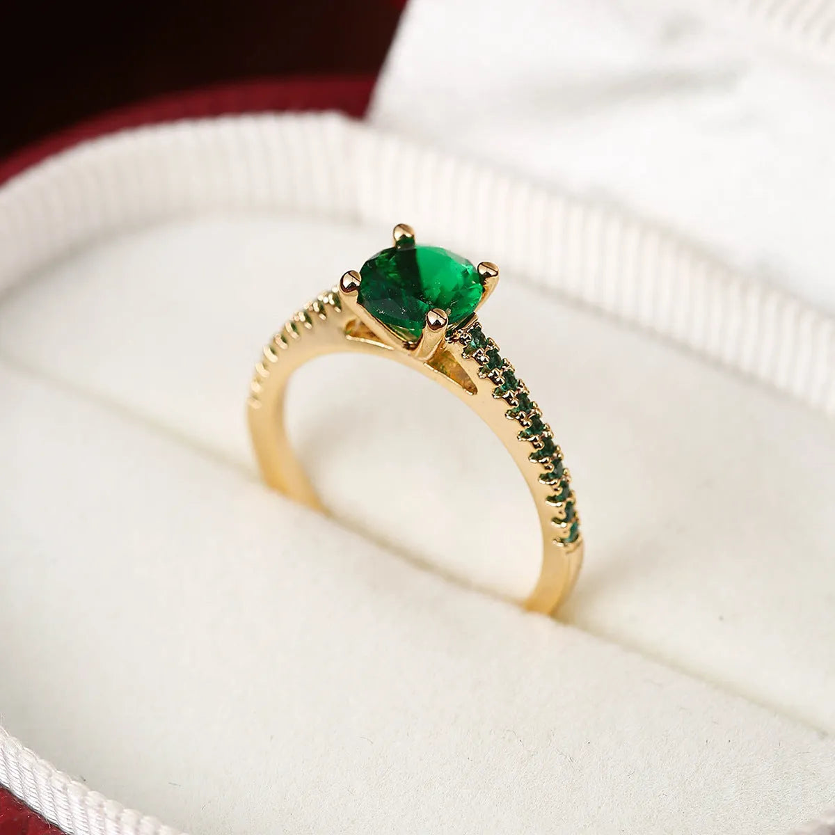 Copper zircon hexagonal geometric ring in a gold rose red electroplated finish.