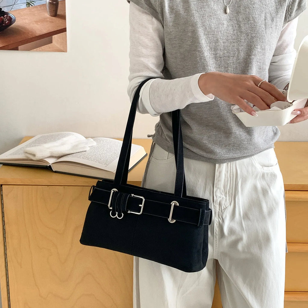 Retro minority design underarm bag in apricot colour with horizontal square shape and double shoulder straps.