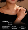 Stainless steel digital bracelet watch with diamond-set numbers on the face, shown in gold tone.