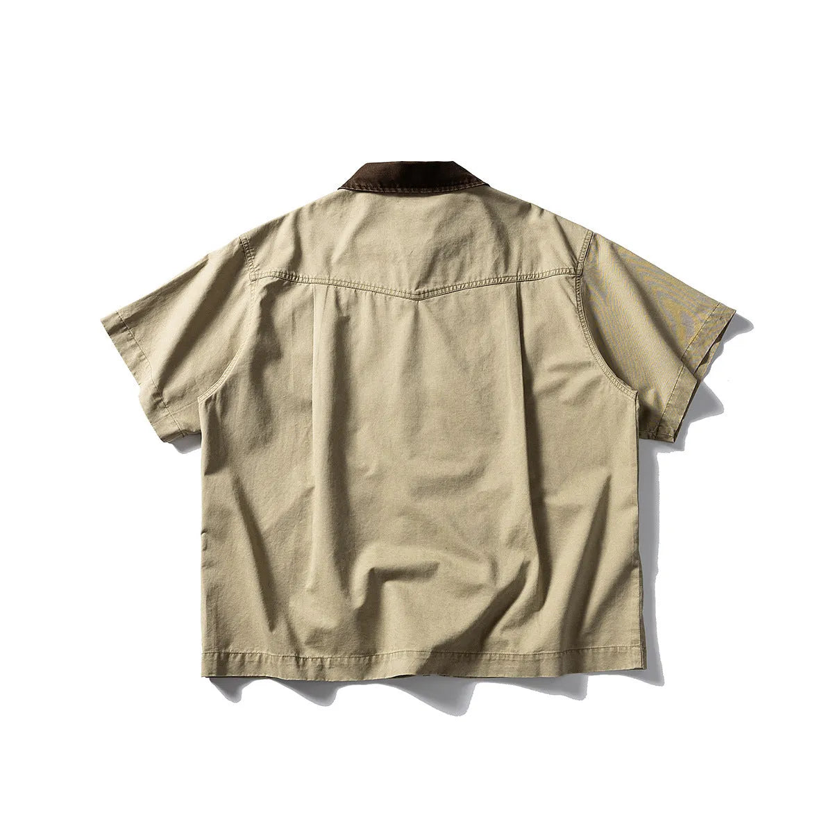 Short sleeve washed overalls shirt in loose cardigan style, shown in khaki colour.