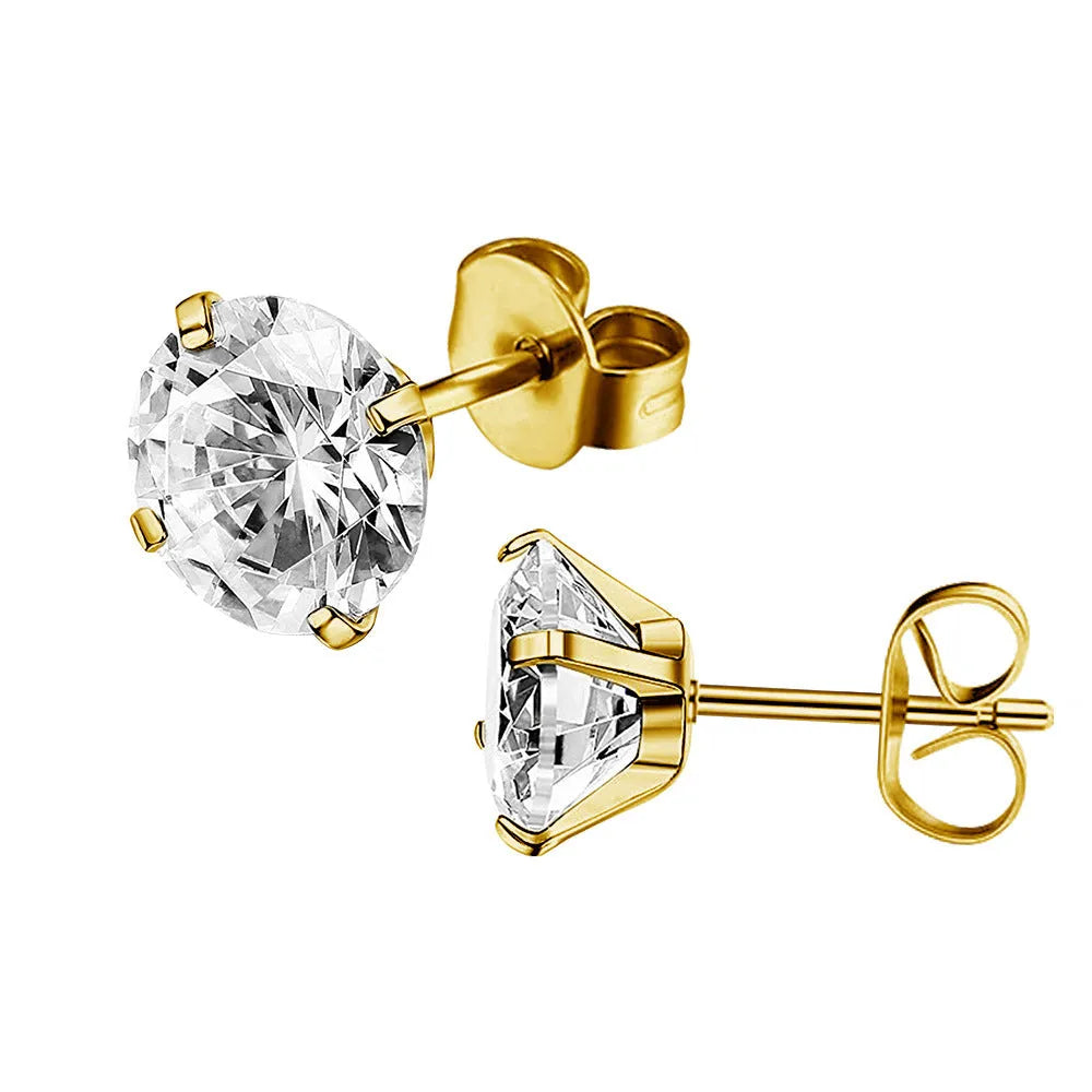 Simple geometric stud earrings with zircon stone in gold or steel colour on grey background.