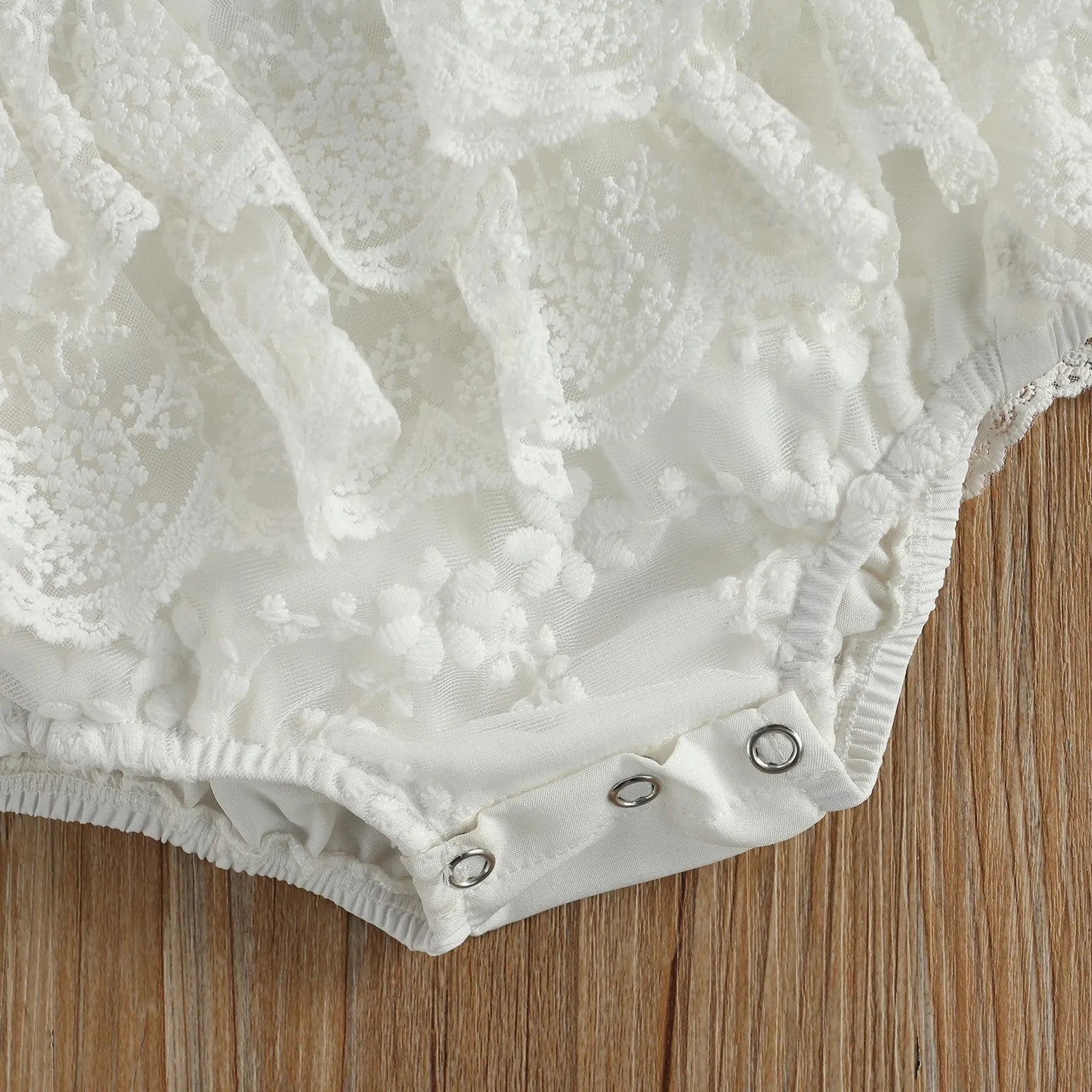 White polyester baby Christmas bodysuit for unisex children aged 3 to 24 months.