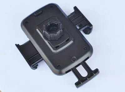 Black car phone holder inserted in CD port with adjustable clamp holding a smartphone horizontally for GPS navigation
