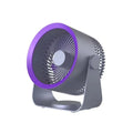 Gray wall-mounted fan with four blades and USB cable on a white wall