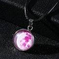 Luminous Christmas moon and starry night sky pendant necklace on a chain with extension.