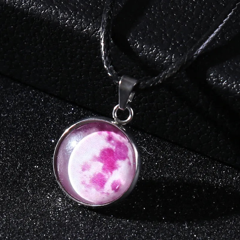 Luminous Christmas moon and starry night sky pendant necklace on a chain with extension.