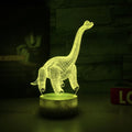 Colourful dinosaur 3D LED night light with remote control on a desk