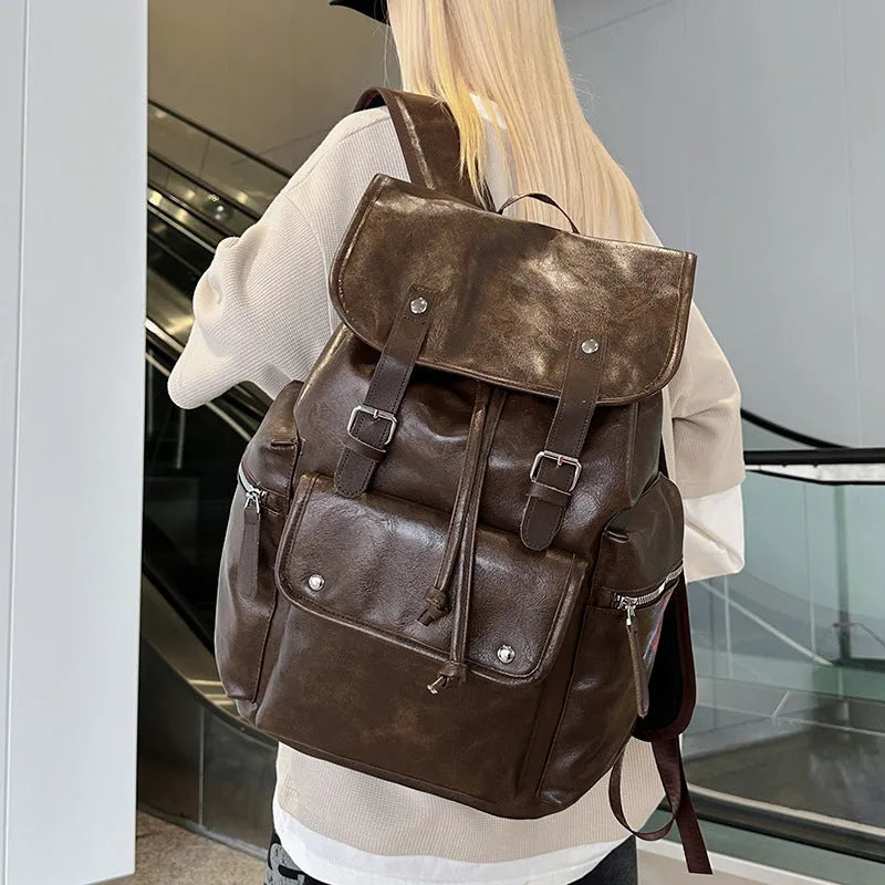 Solid colour PU couple travel backpack in black, curved shoulder strap, waterproof design for leisure travel