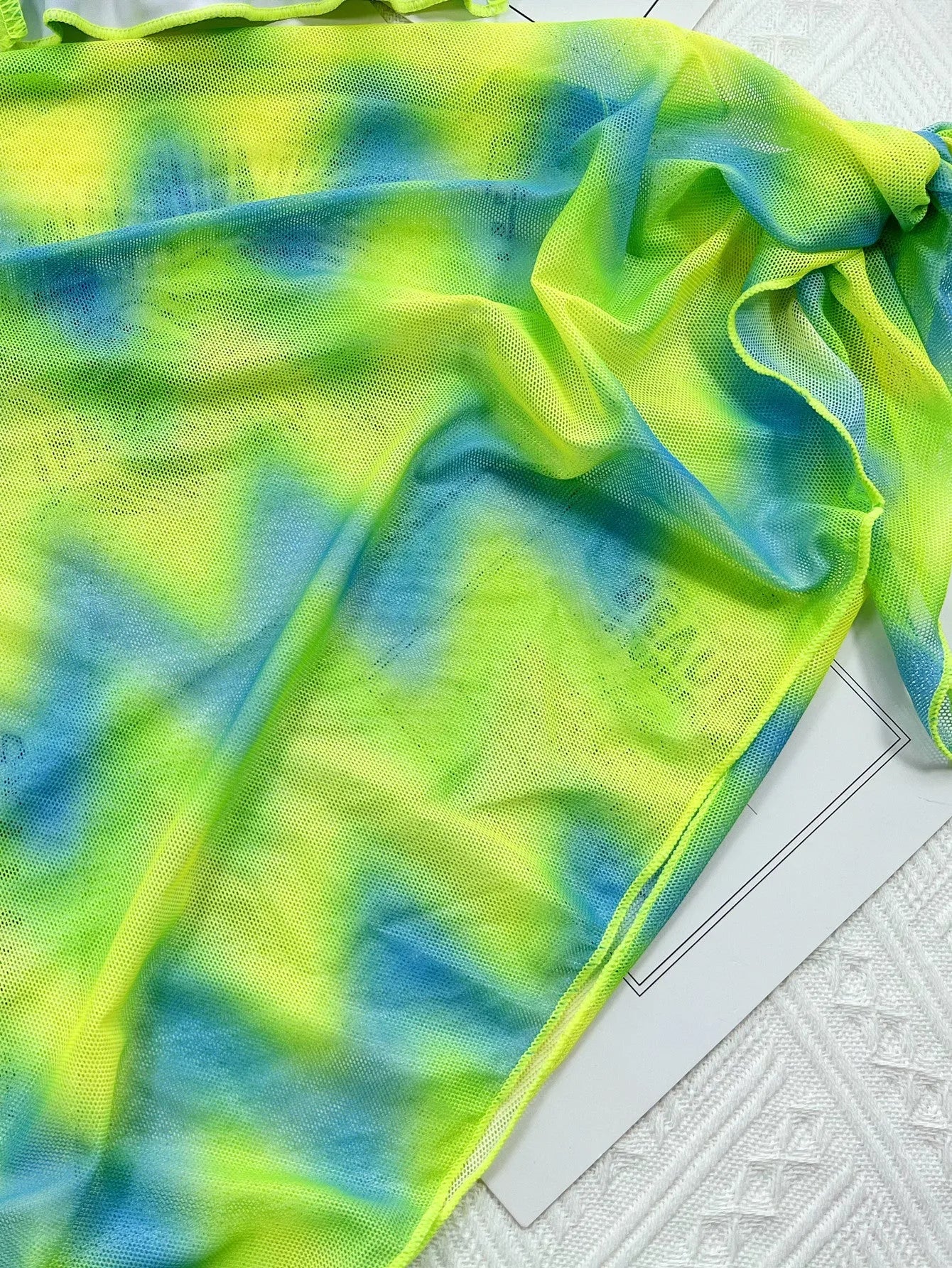 Green tie-dyed women's bikini swimsuit with matching skirt cover-up
