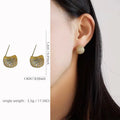 Gold and white geometric drop earrings with full diamond flashing and little golden beans design