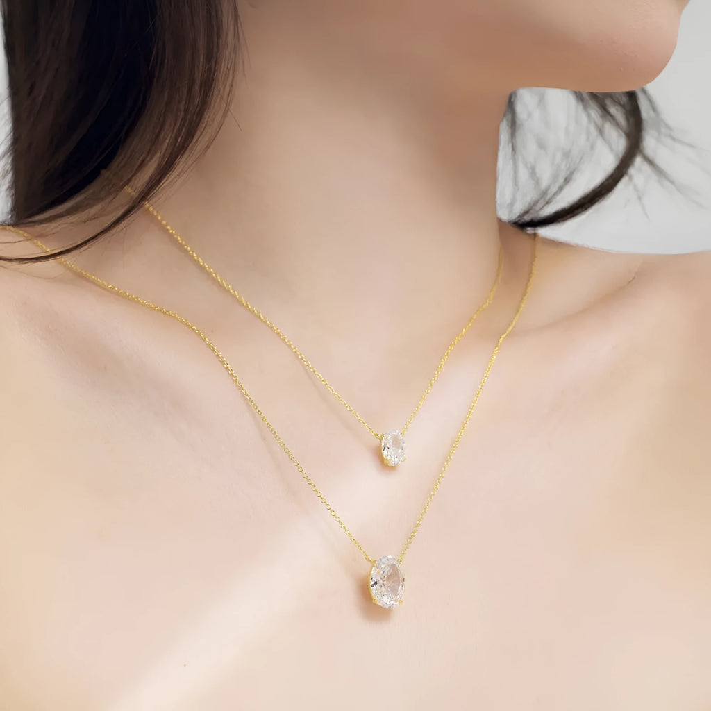 Women's sterling silver necklace with geometric oval ice flower pendant in platinum or gold finish