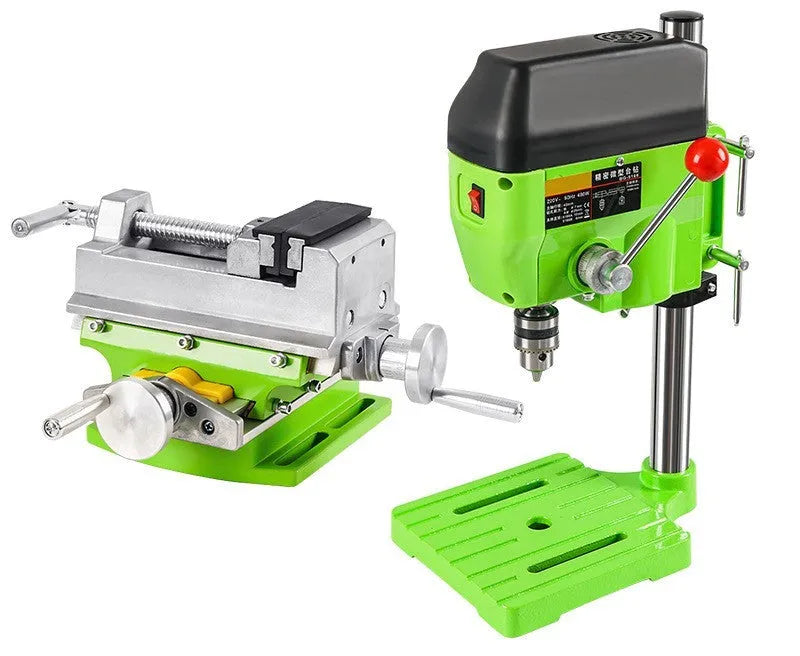 Mini bench drill milling machine on a workbench with optional pliers or drill accessories.