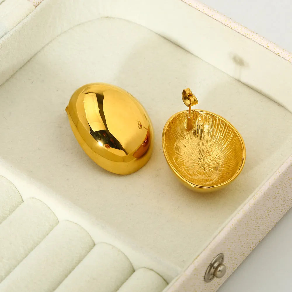 Geometric ear studs with electroplated 18K gold finish and line pattern detailing