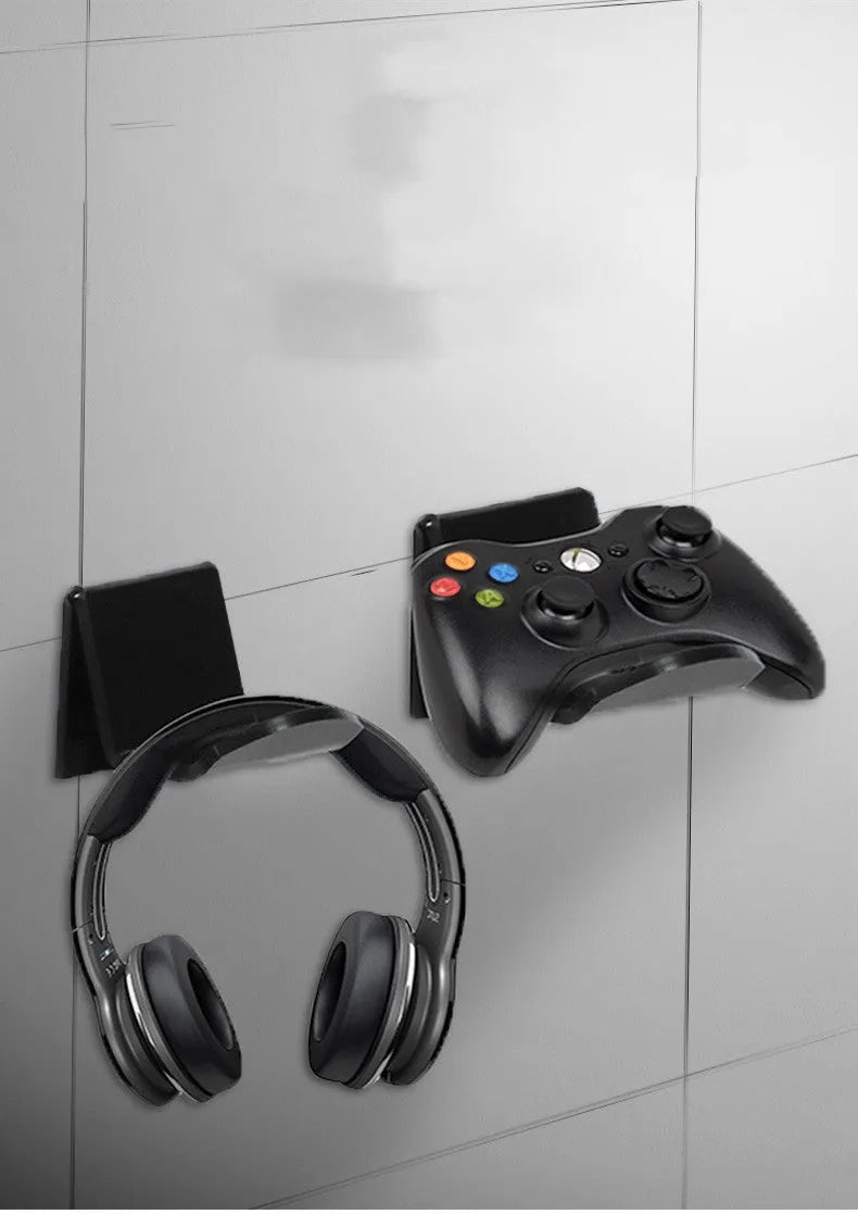 Universal game controller mounting bracket in black colour with nail and adhesive installation options