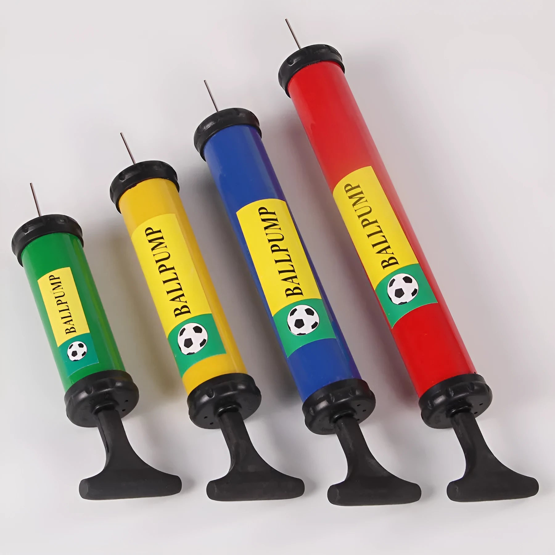 Mixed colour plastic manual hand pump for inflating basketballs, footballs, and balloons.