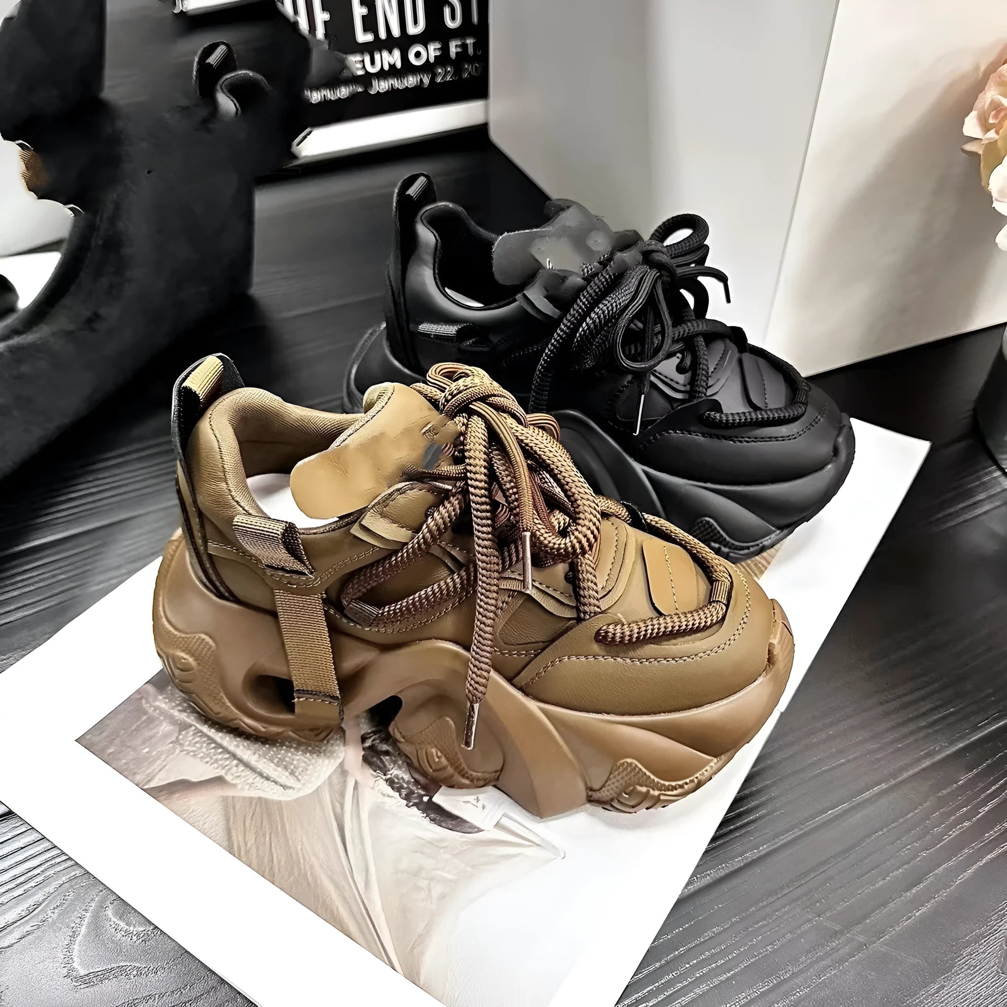 Women's creamy white casual wedge sneakers with lace-up front and cross-strap detail.