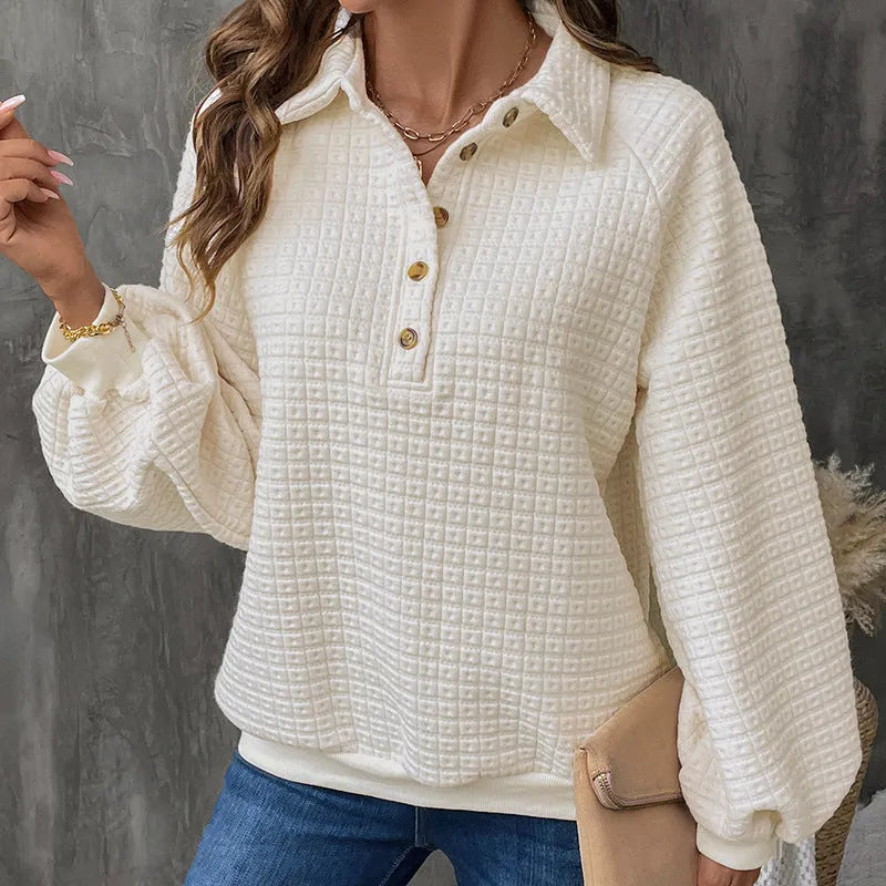 Women's solid colour polo collar sweater with long sleeves in a textured knit.