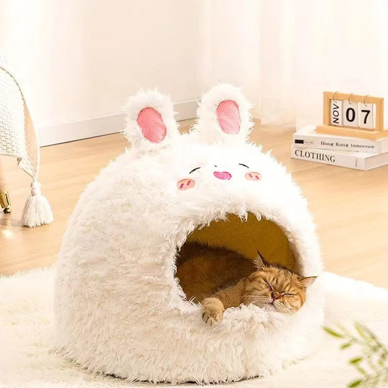 Semi-enclosed yurt-style cat litter tent in an animal print, shown next to a litter tray.