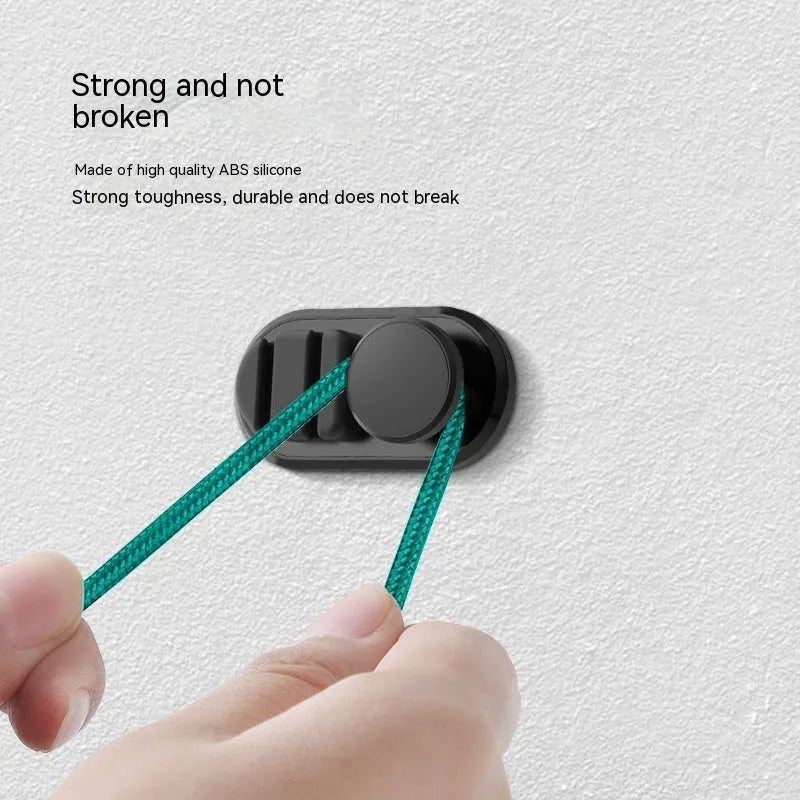 Adhesive car storage hook for cables in dark green colour showing dimensions and mounting surface
