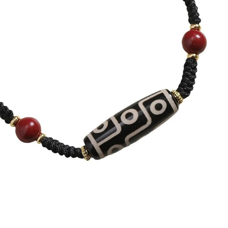 Men's shrinkable agate bracelet with Tibetan Dzi bead patterns on a wrist