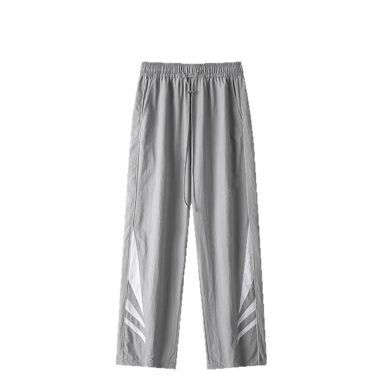 A pair of black straight-leg men's casual trousers on a hanger, showing the mid-rise waist and non-ironing fabric texture.