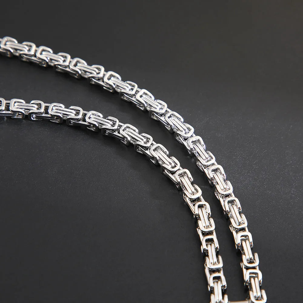 Men's titanium steel water ripple geometric pendant necklace on Emperor Chain in black, gold, or silver.