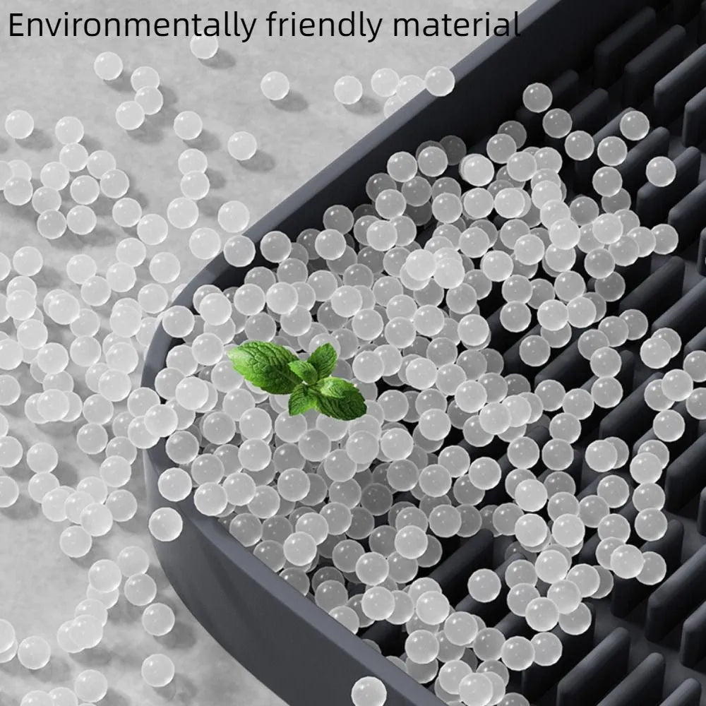Black cat litter pedal with slanted design and textured grooves for litter containment