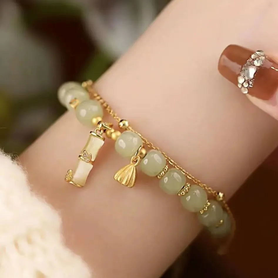 Retro bamboo design bracelet with Ruyi symbol and floral glass beads in electroplated finish