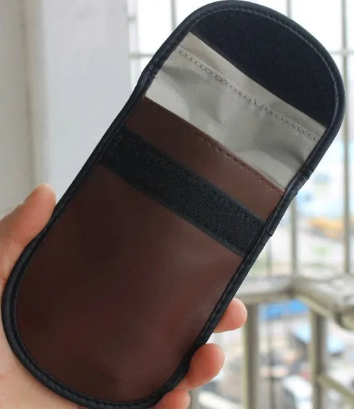 Black microfiber Faraday cage signal blocker bag for car key fobs and RFID cards.