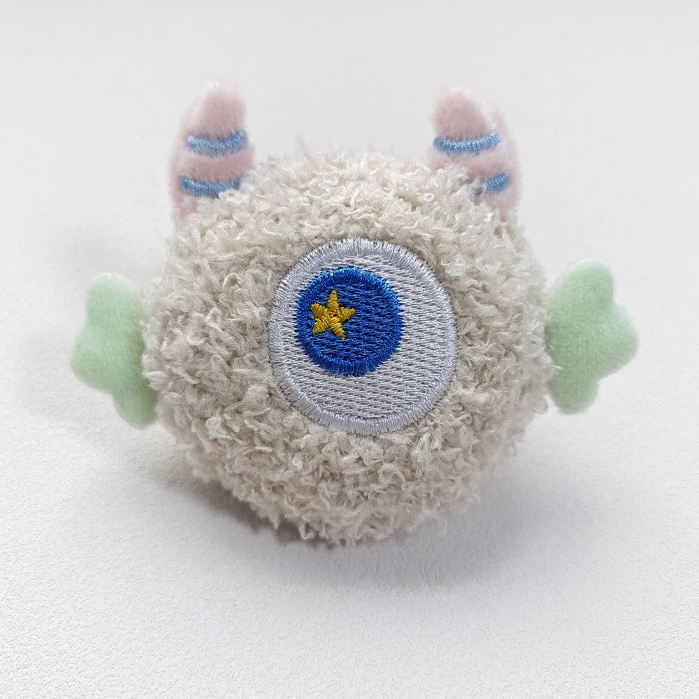Plush cartoon dog chew toy with large eyes and squeaky sound, shown in multiple colours.