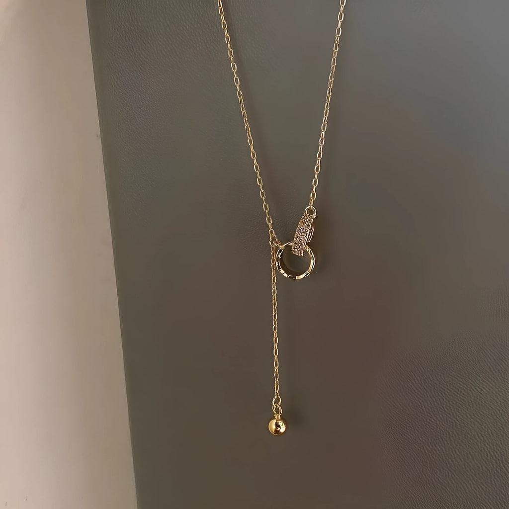 Gold necklace clavicle chain on display showing pendant-free design and gold plating finish
