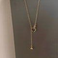 Gold necklace clavicle chain on display showing pendant-free design and gold plating finish