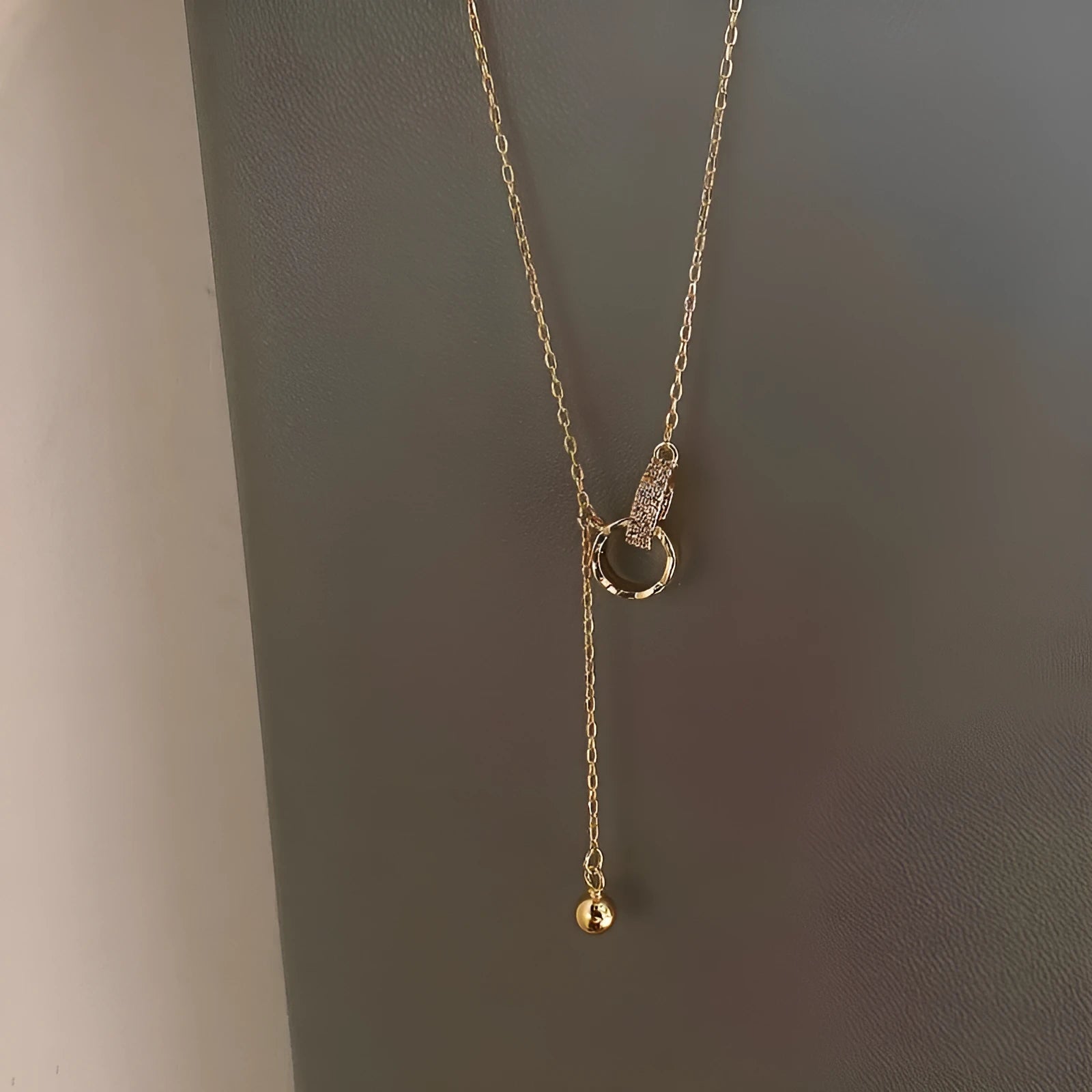Gold necklace clavicle chain on display showing pendant-free design and gold plating finish