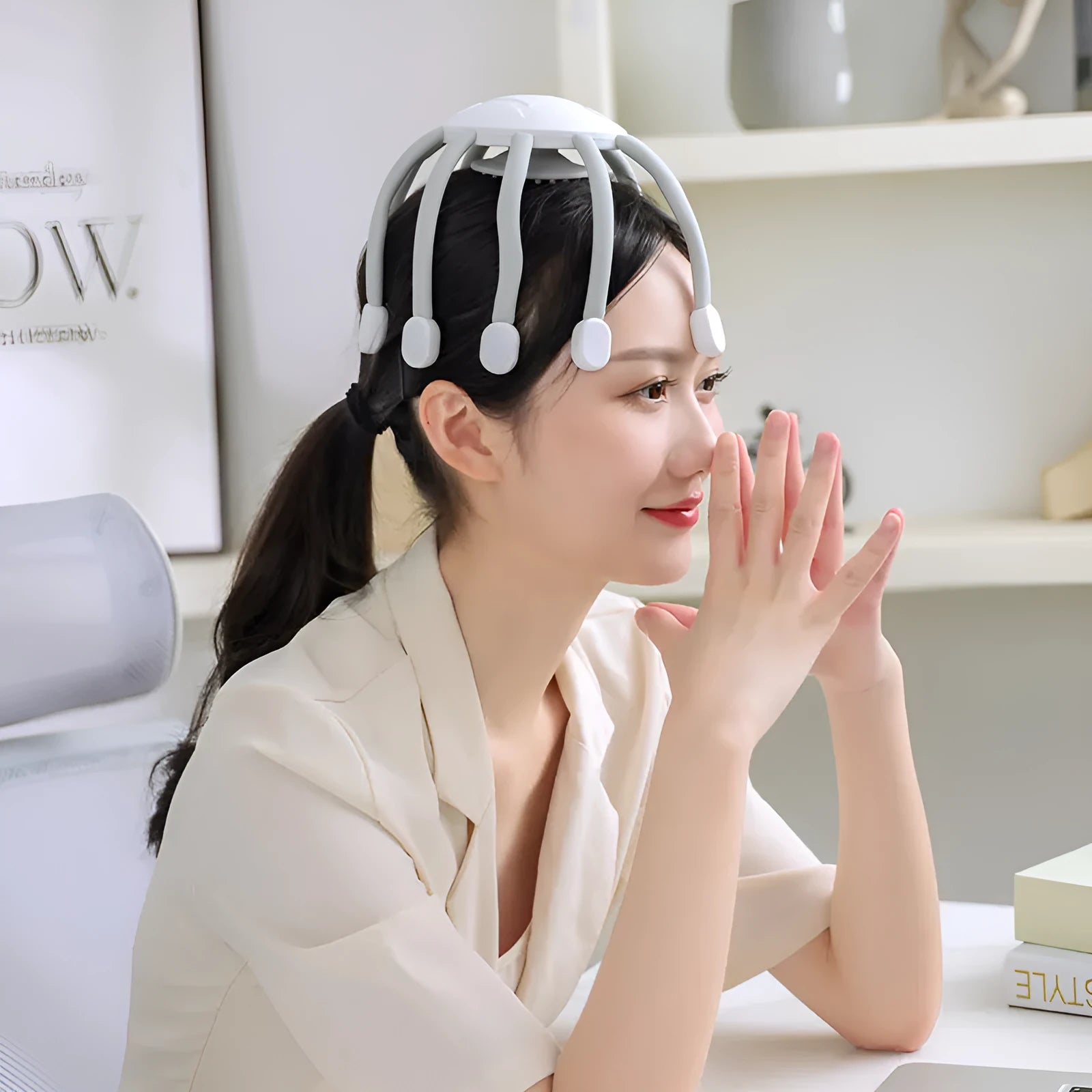 USB rechargeable head massager with multiple silicone vibrating claws in black colour